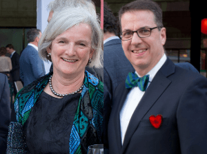 The two 2019 gala co-chairs are pictured in a crop image, each smiling at the camera. Georgia is on the left, and Tom is on the right.